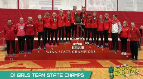 Image of Varsity Girls Cross Country team receiving the WIAA State Champions award for 2018
